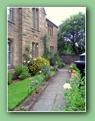 The Holy Ghost Fathers have beautiful flowers in front of their house.